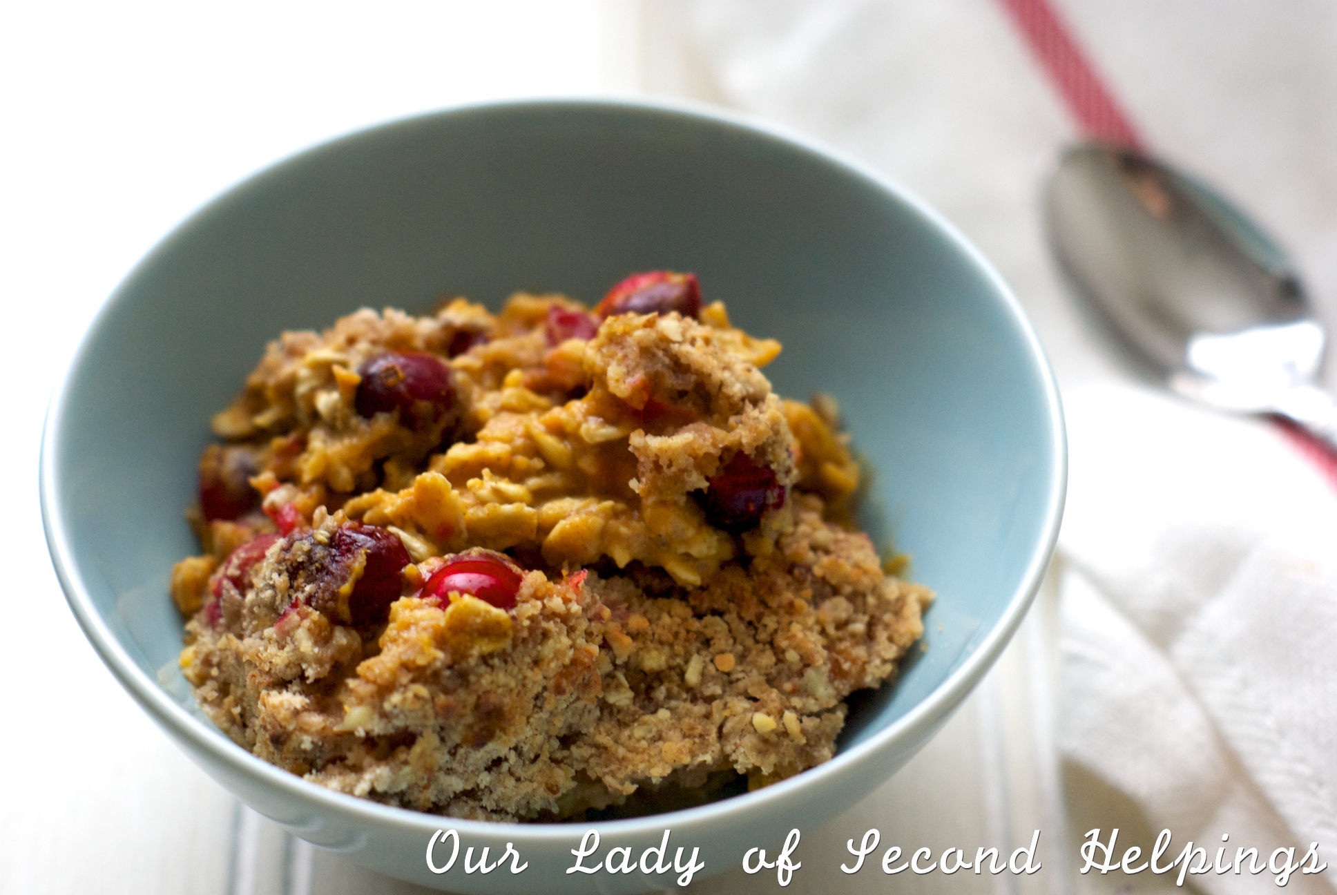 Pumpkin Oatmeal with Cranberries in a blue bowl