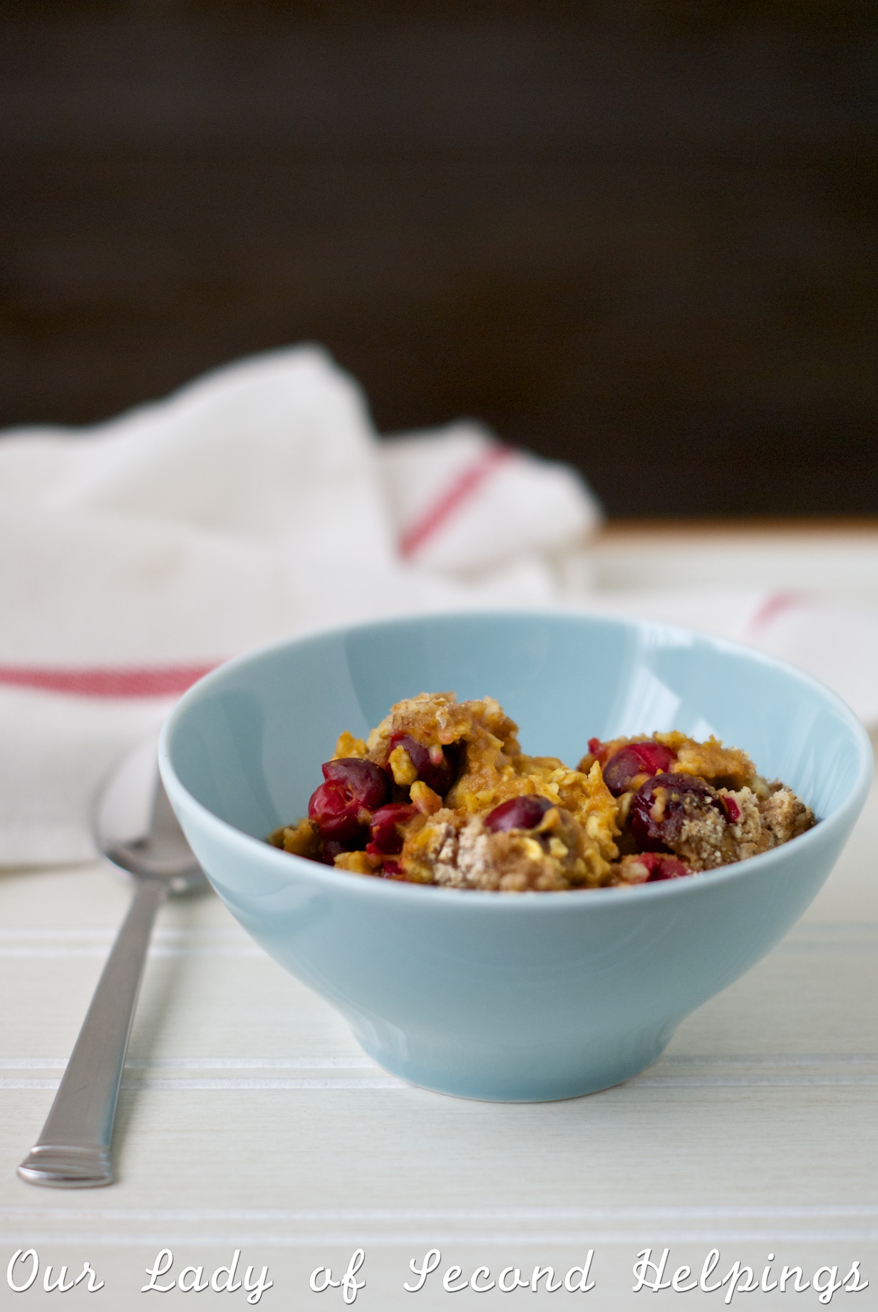 Pumpkin Oatmeal with Cranberries in a blue bowl